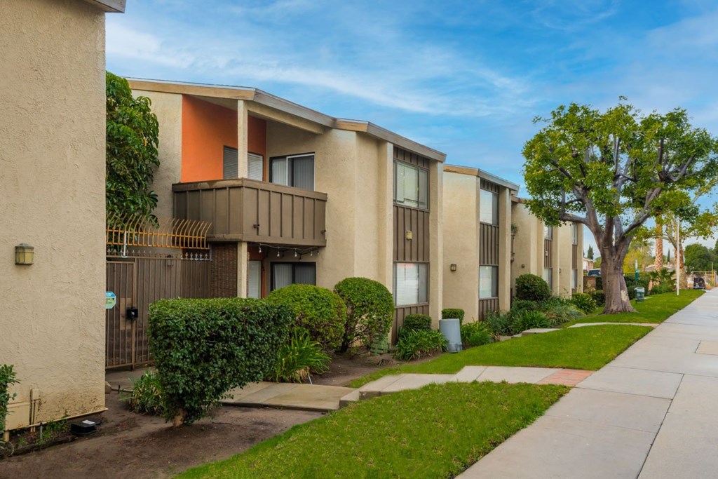 Front of building with grass and sidewalk